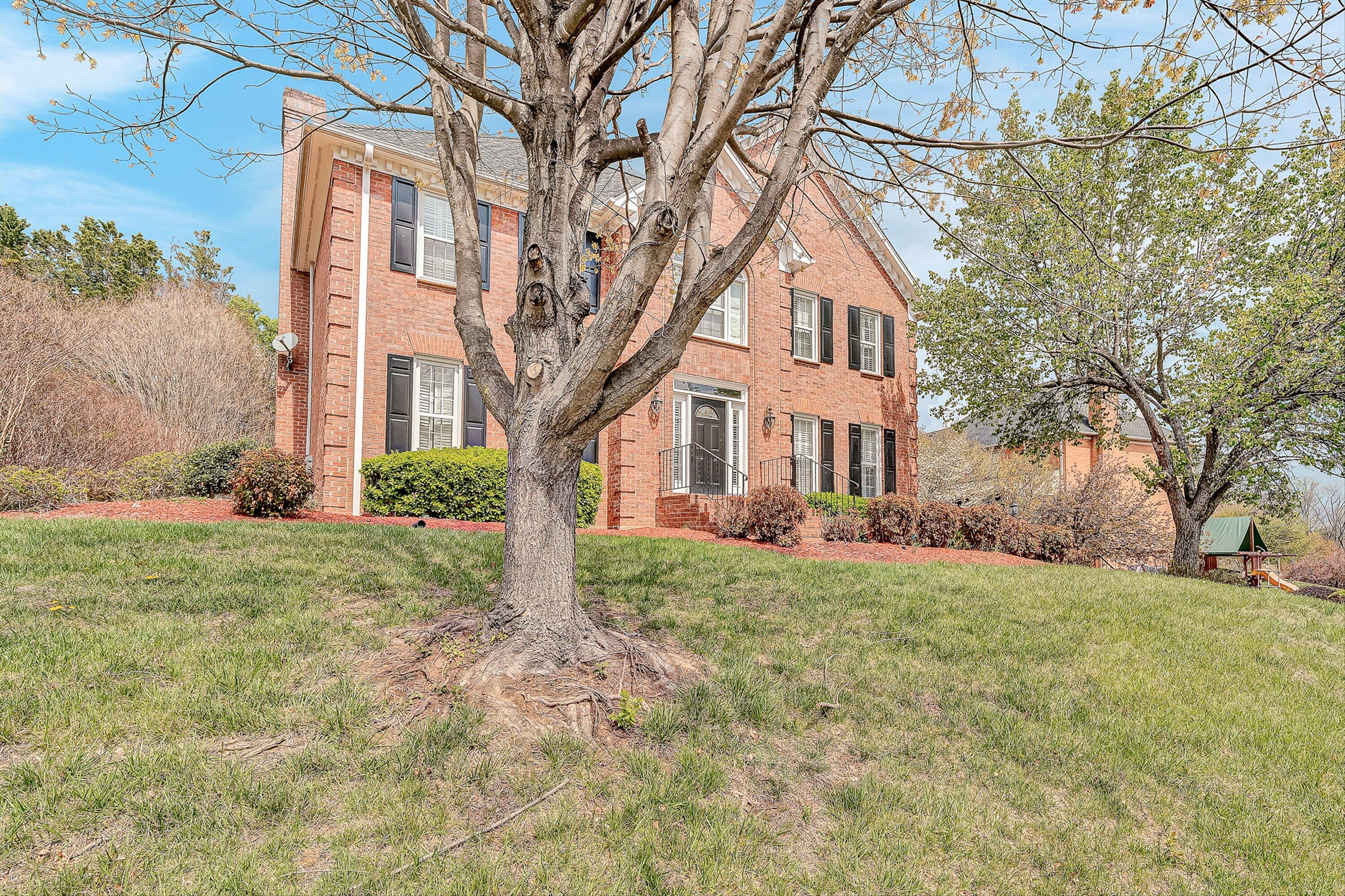 8317 Cardington Drive Roanoke, VA 24019 - Photo 2 of 43 a front view of a house with a yard
