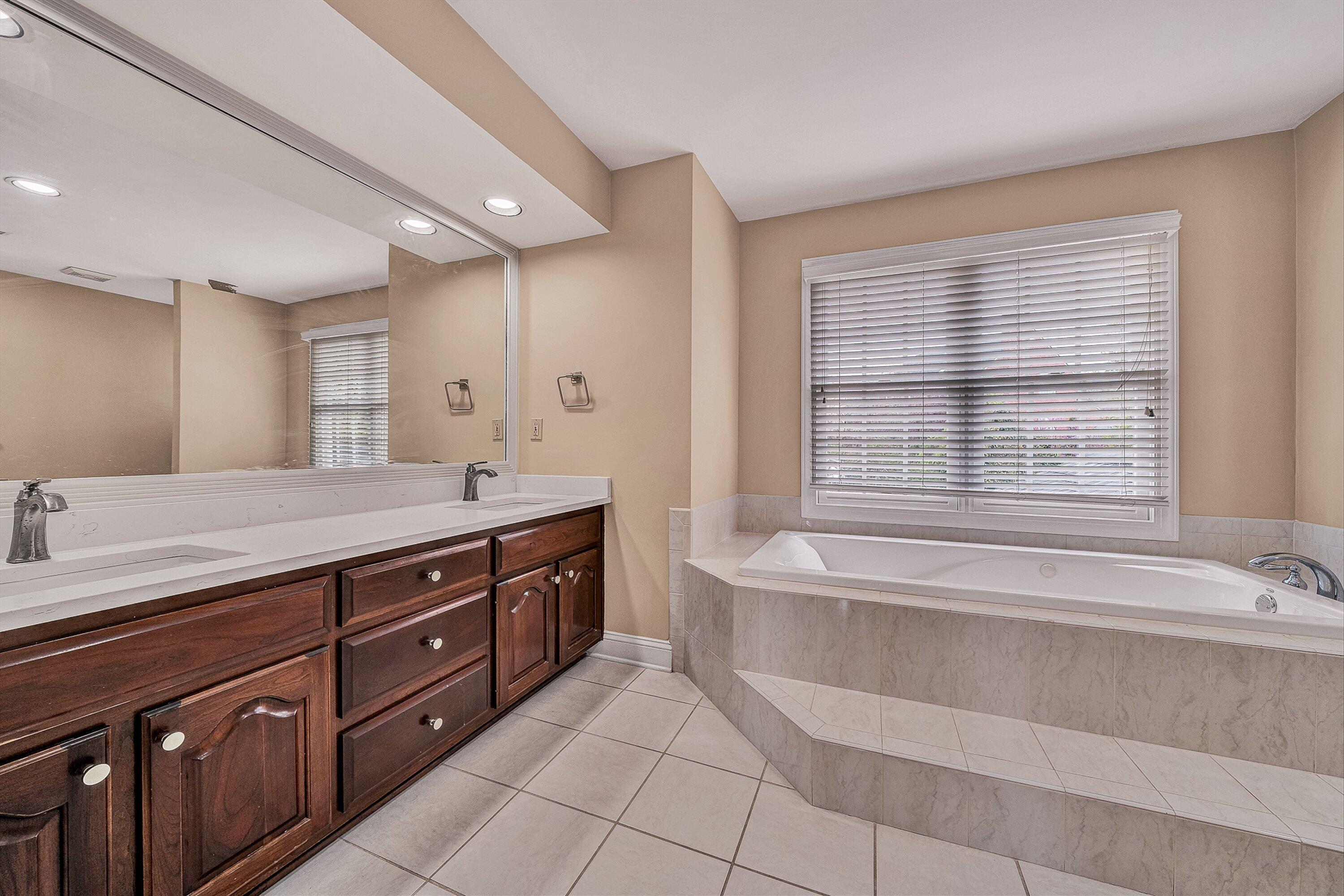 8317 Cardington Drive Roanoke, VA 24019 - Photo 21 of 43 a spacious bathroom with a tub sink and mirror