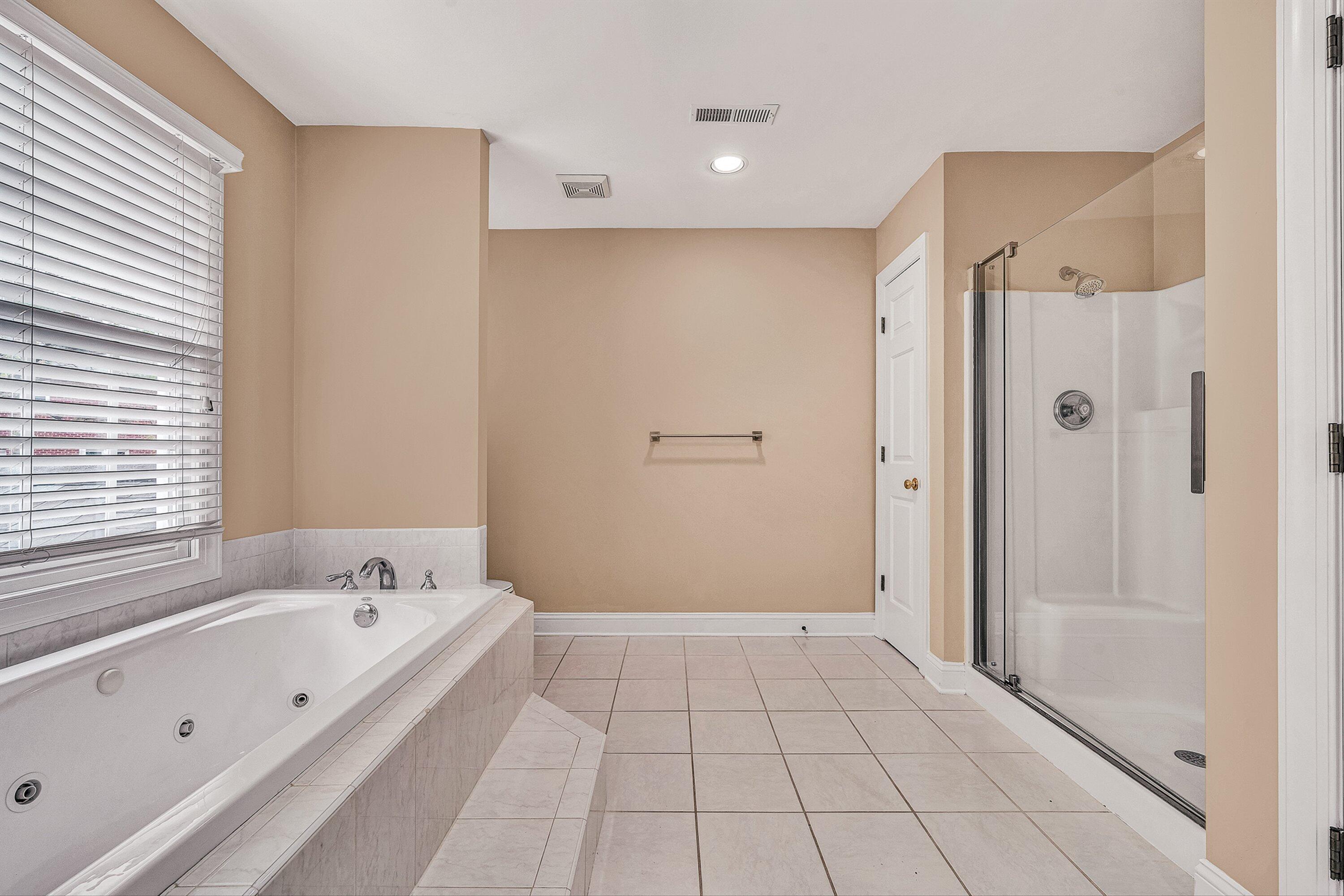 8317 Cardington Drive Roanoke, VA 24019 - Photo 22 of 43 a bathroom with a bathtub and a shower