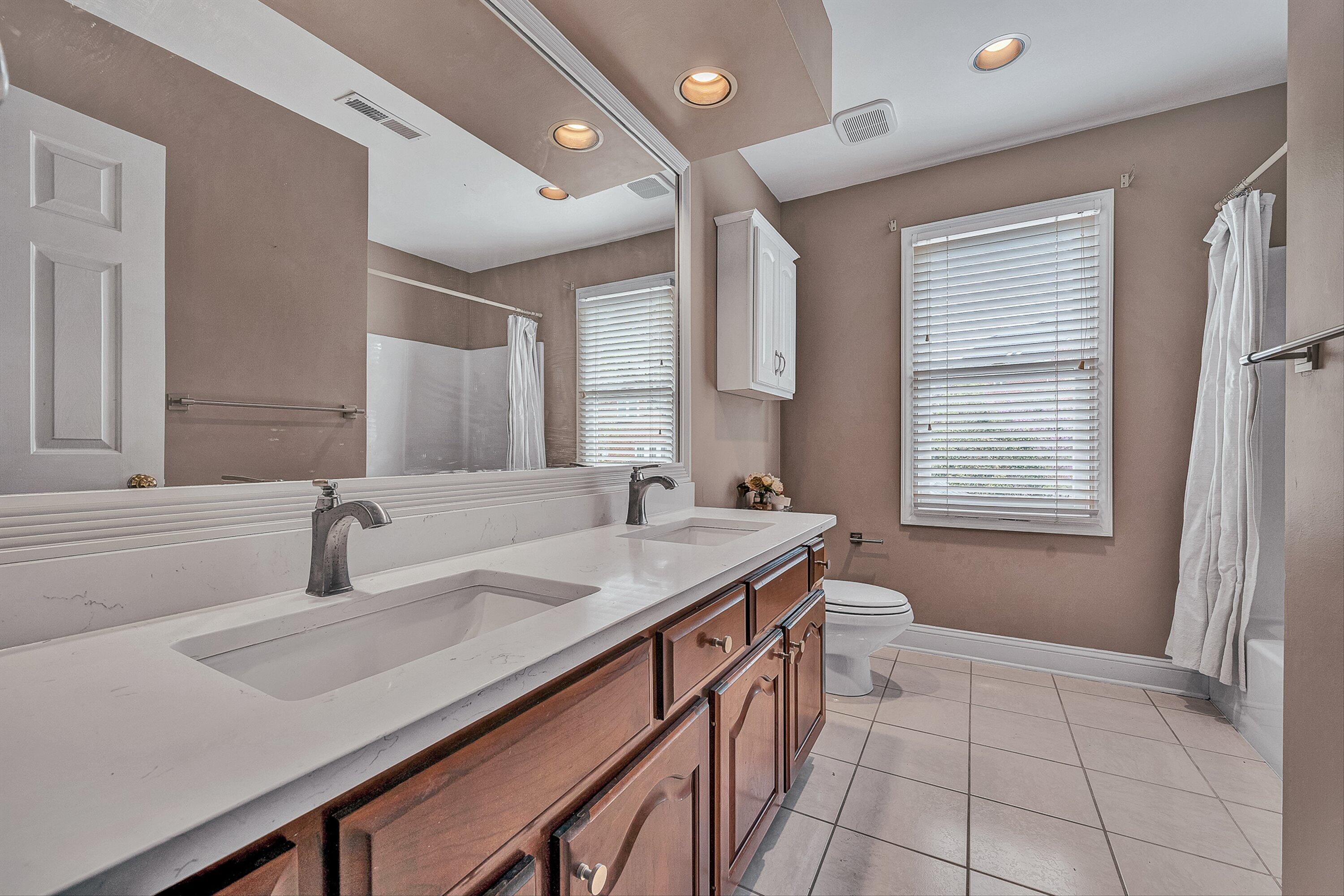 8317 Cardington Drive Roanoke, VA 24019 - Photo 23 of 43 a bathroom with a sink and a mirror