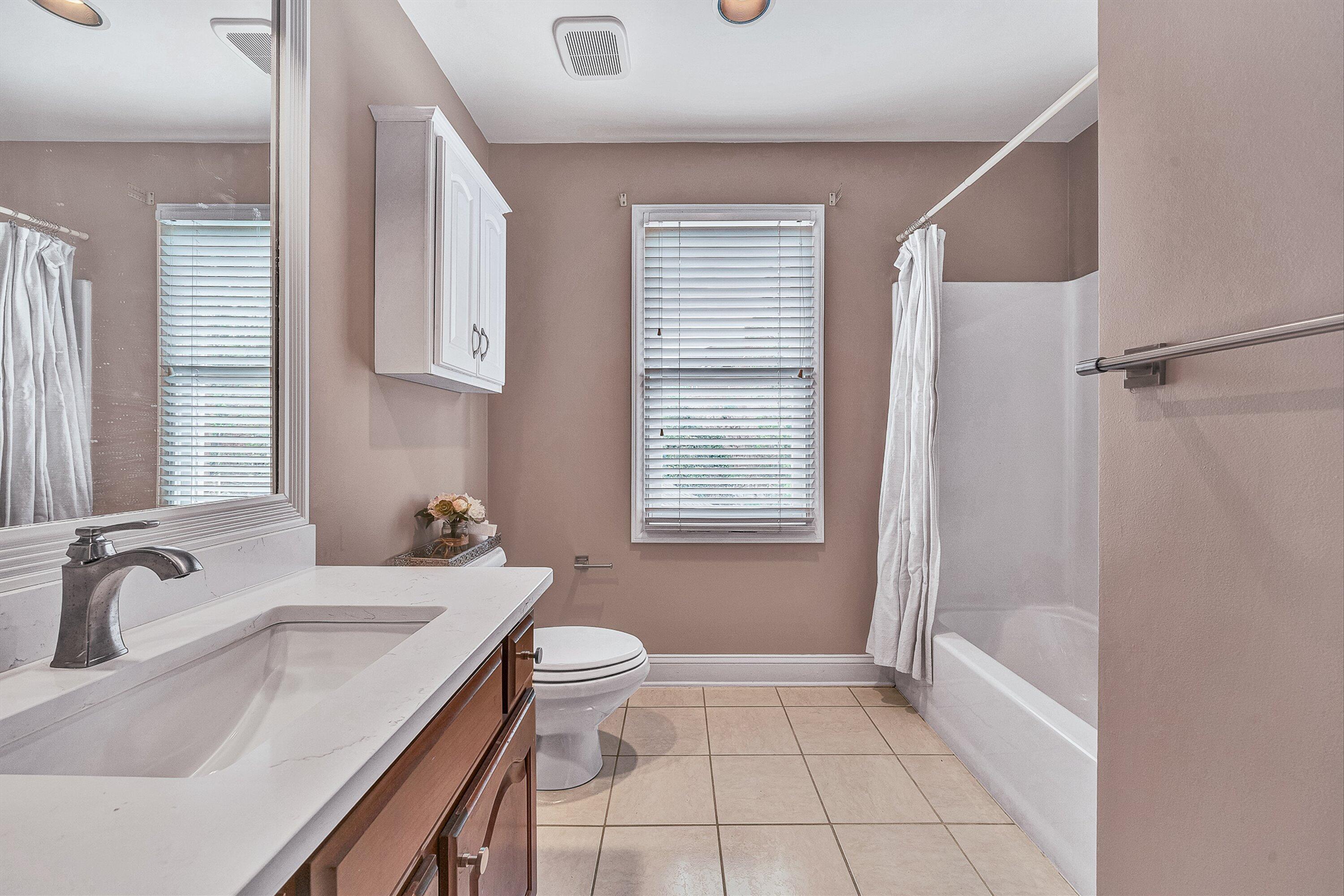 8317 Cardington Drive Roanoke, VA 24019 - Photo 24 of 43 a bathroom with a sink a toilet and shower