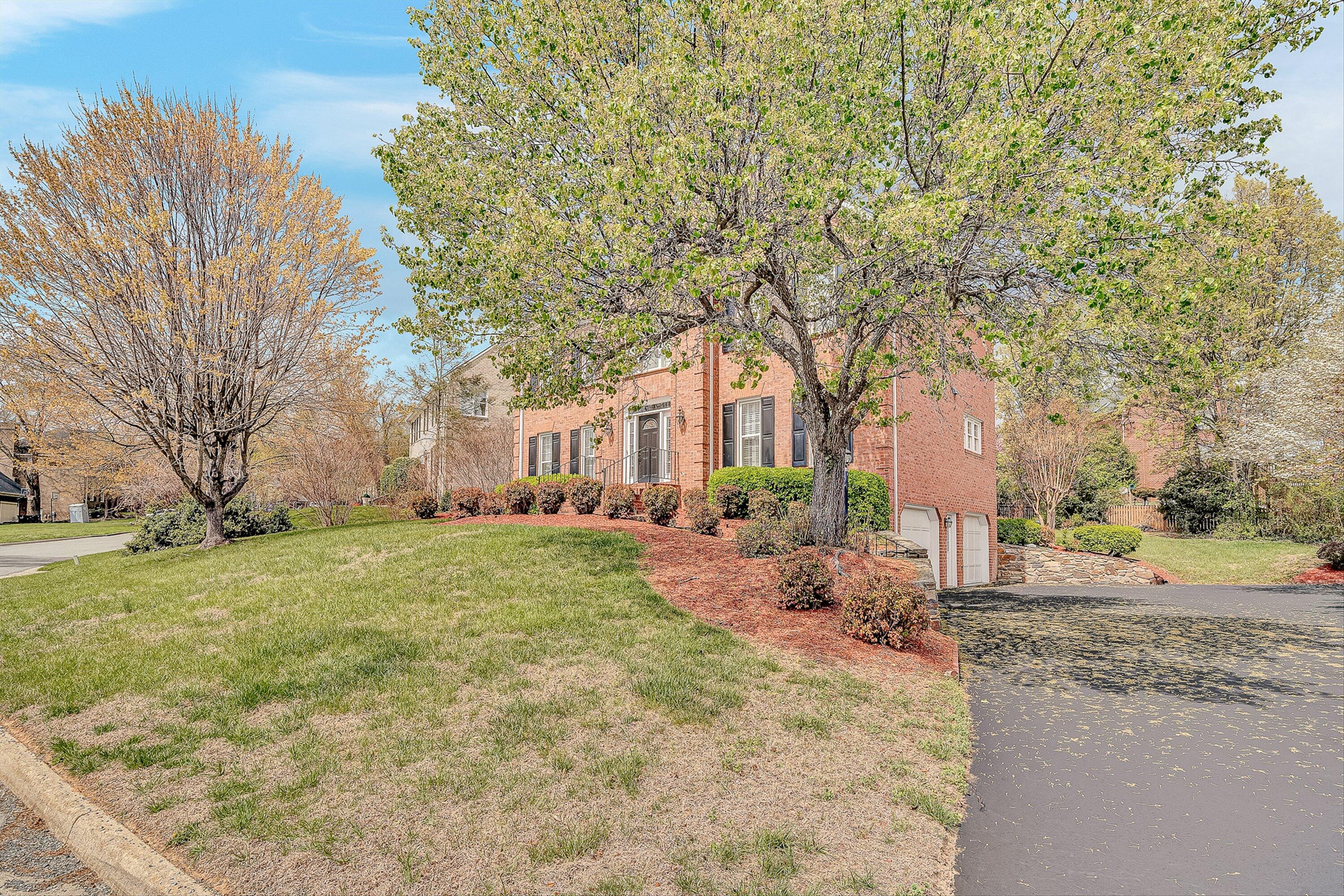 8317 Cardington Drive Roanoke, VA 24019 - Photo 3 of 43 a view of a yard with plants and trees