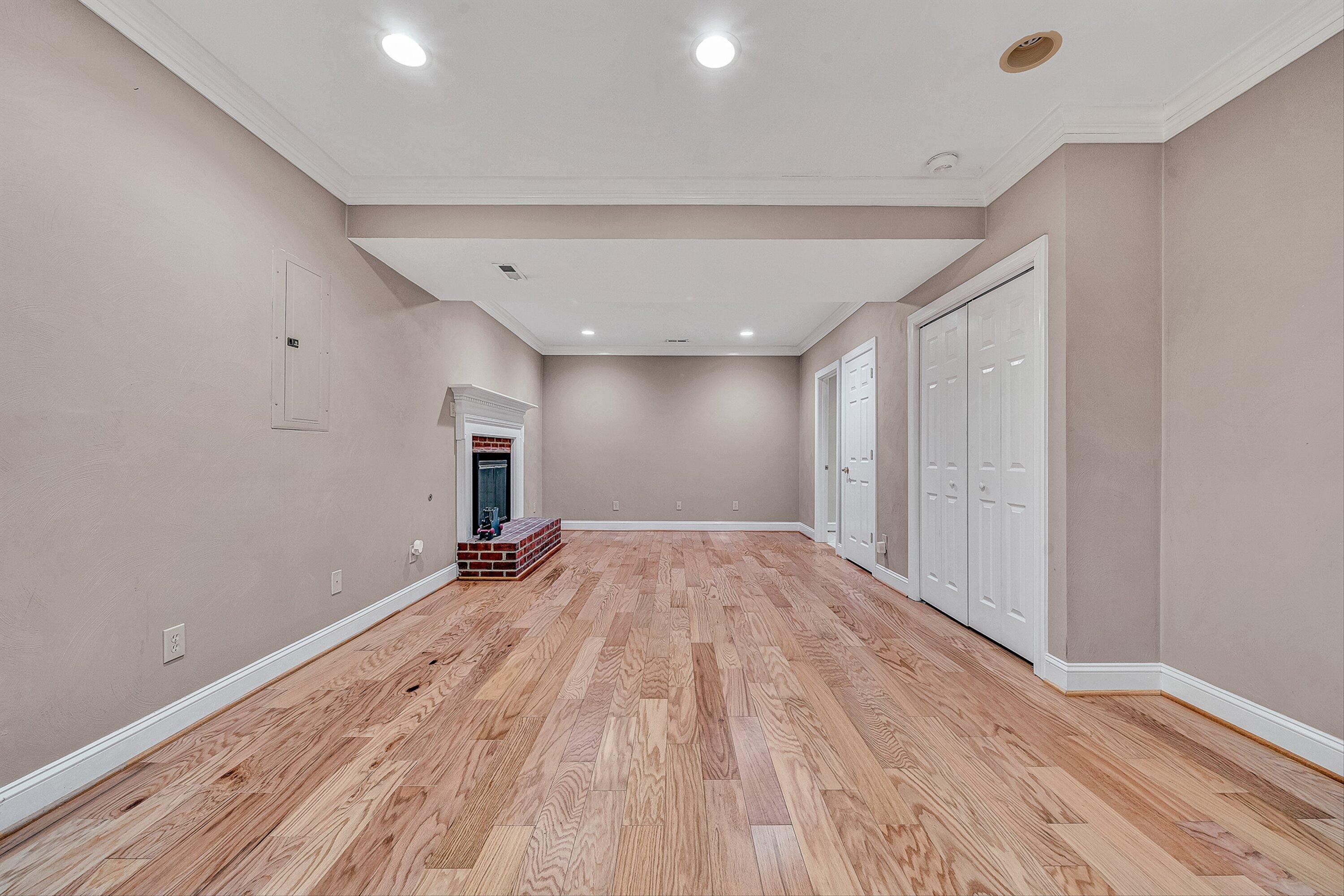 8317 Cardington Drive Roanoke, VA 24019 - Photo 32 of 43 a view of empty room with wooden floor and fireplace