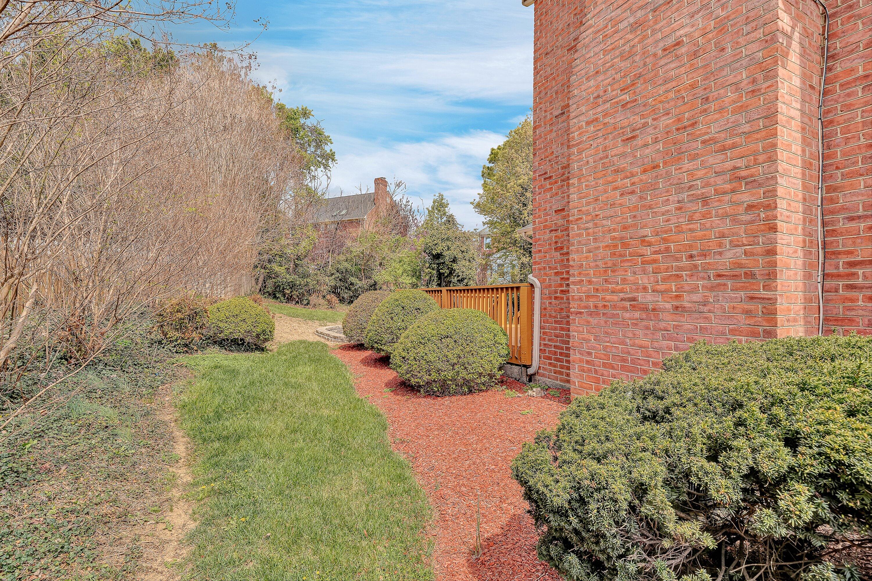8317 Cardington Drive Roanoke, VA 24019 - Photo 38 of 43 a view of a garden with a building in the background