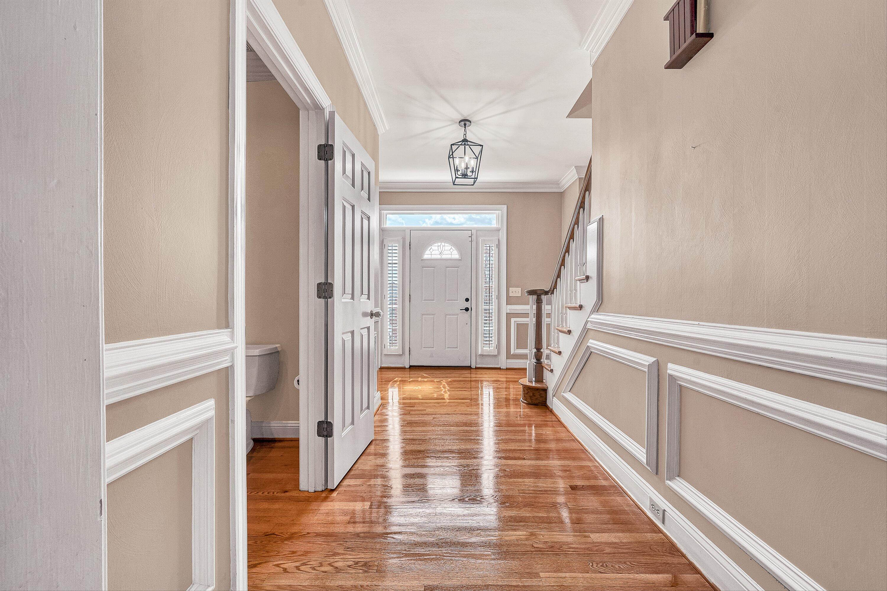 8317 Cardington Drive Roanoke, VA 24019 - Photo 4 of 43 a view of a hallway with wooden floor and staircase