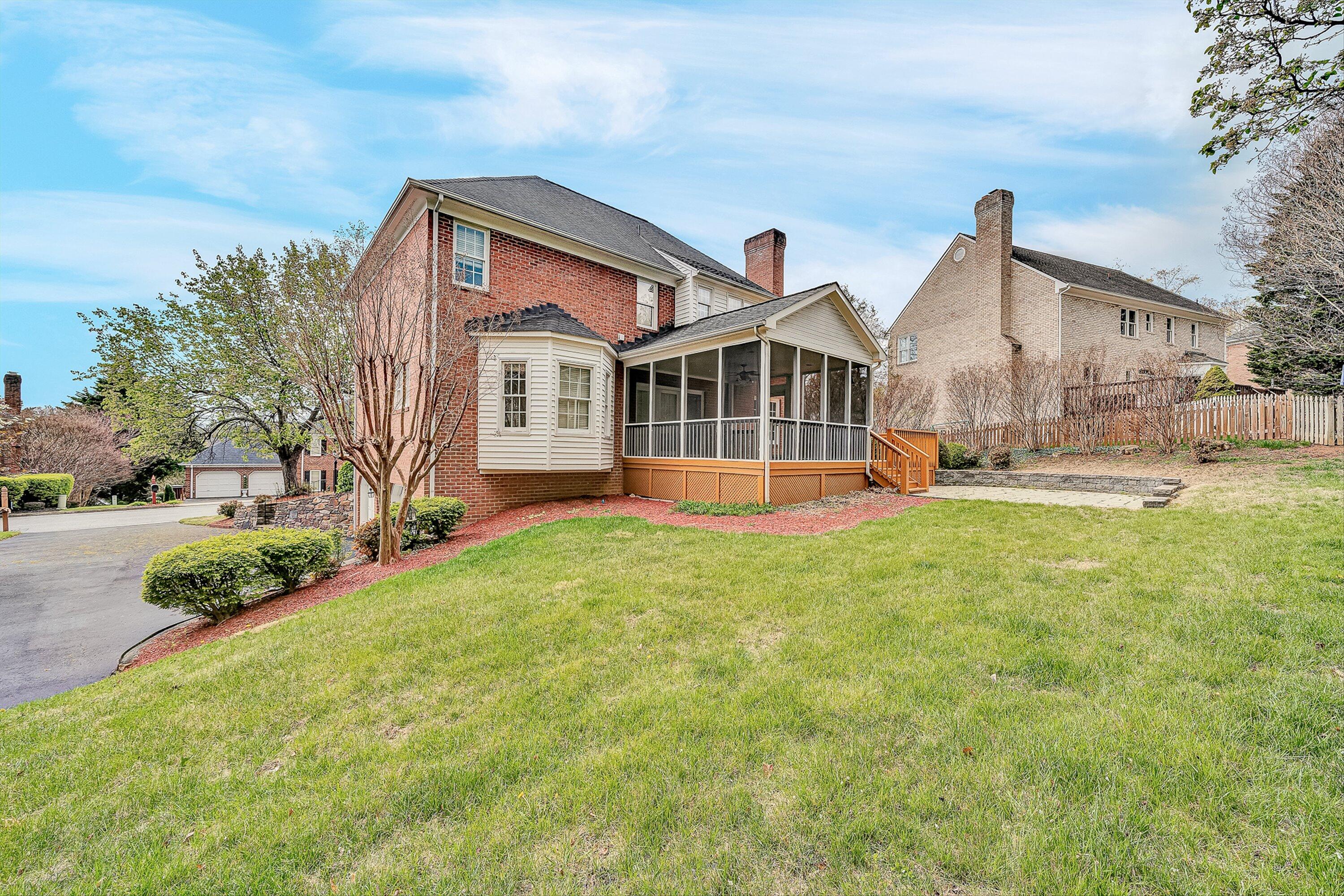 8317 Cardington Drive Roanoke, VA 24019 - Photo 41 of 43 a front view of a house with a yard and trees