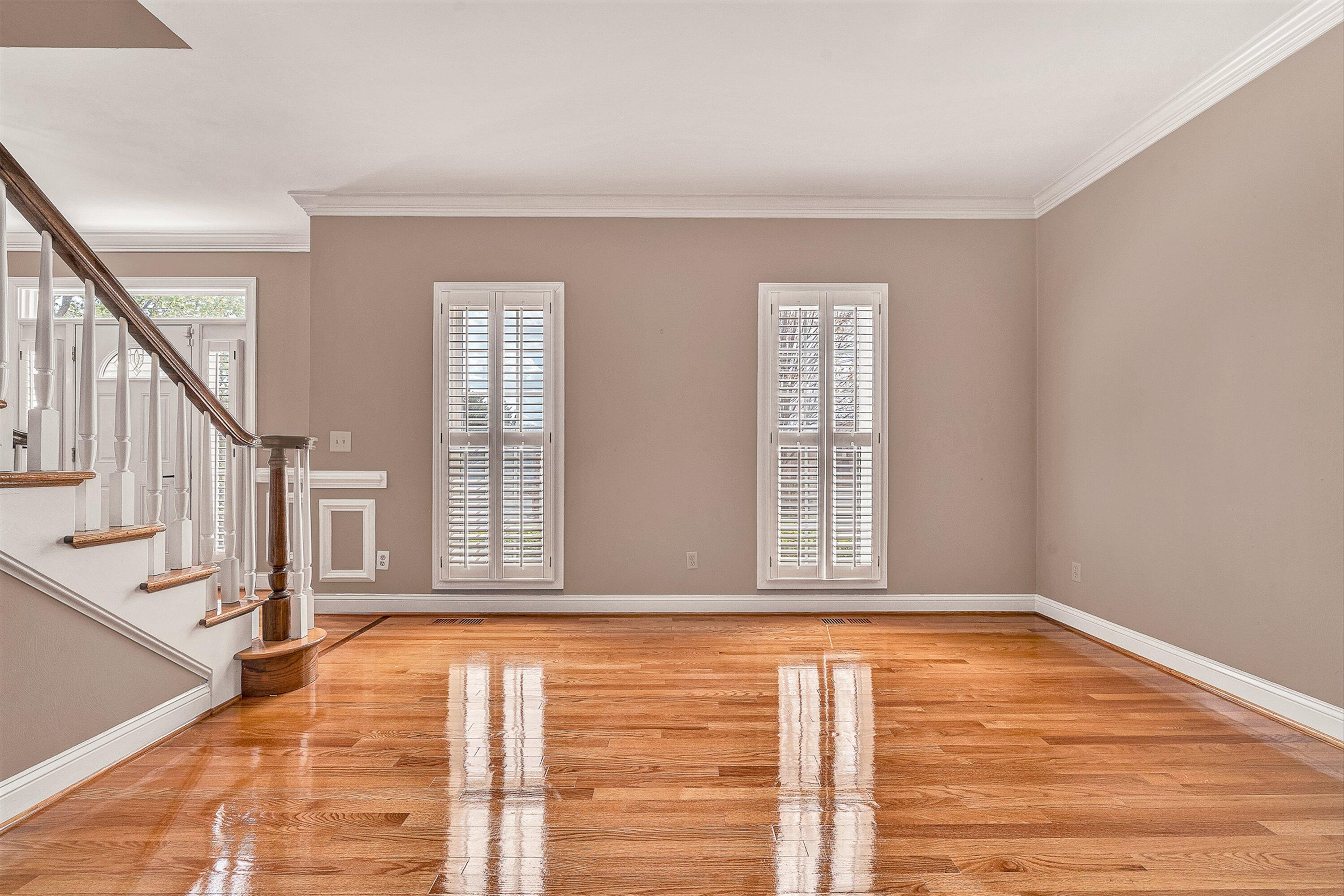 8317 Cardington Drive Roanoke, VA 24019 - Photo 7 of 43 a view of an empty room with wooden floor and a window
