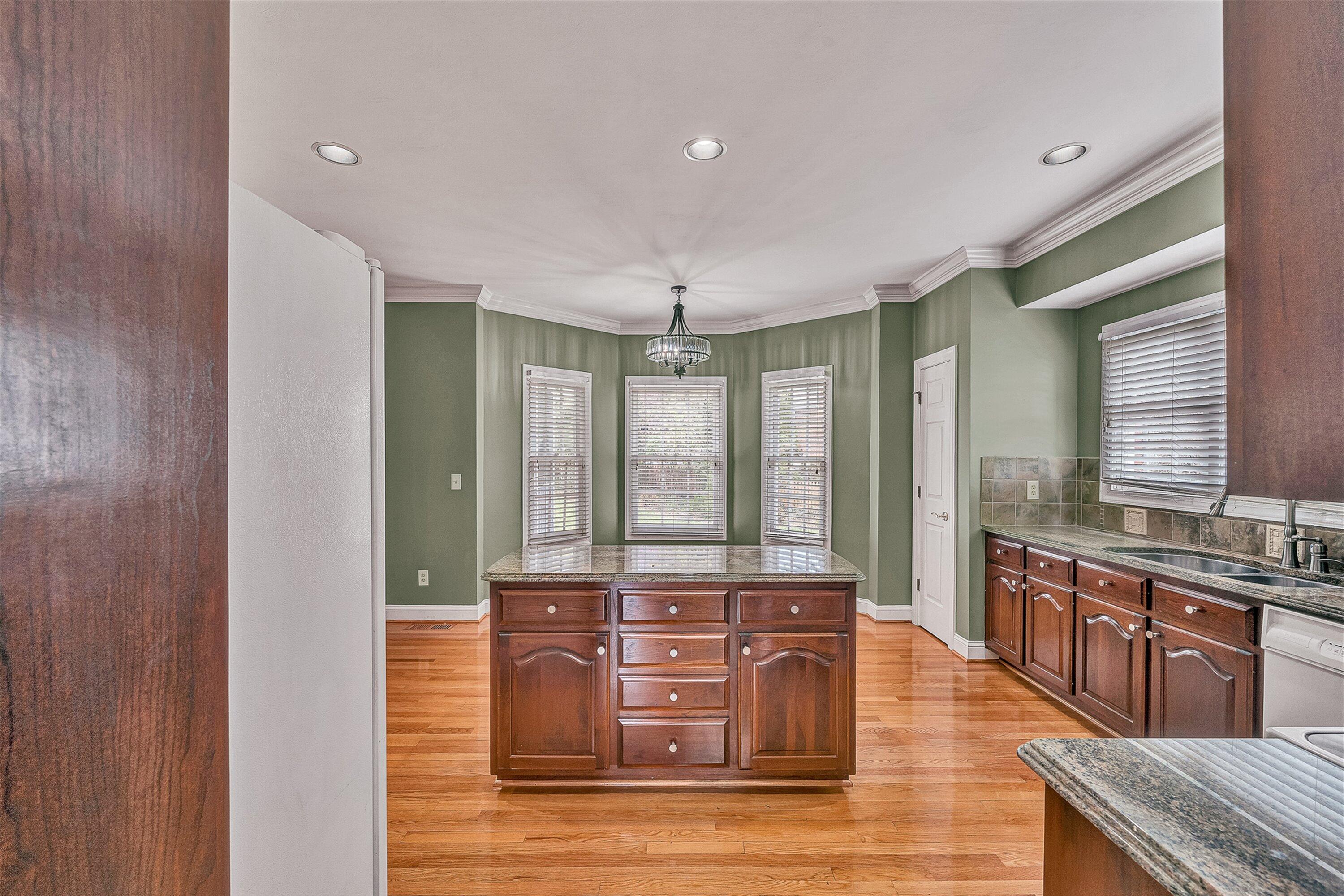 8317 Cardington Drive Roanoke, VA 24019 - Photo 10 of 43 a view of a room with granite countertop wooden floor and staircase