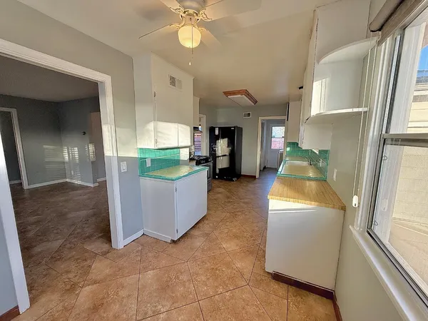 a view of a kitchen with furniture and a kitchen