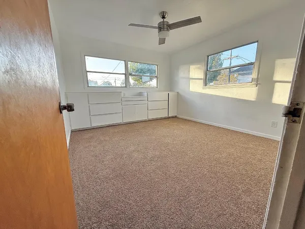 a view of an empty room with a window