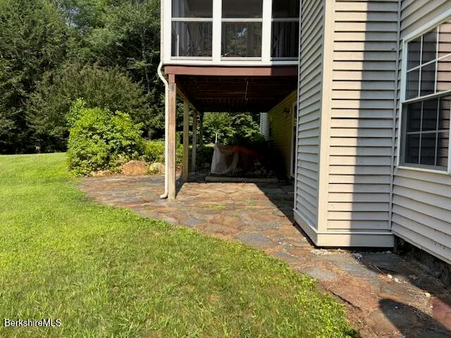 a view of a deck with a backyard