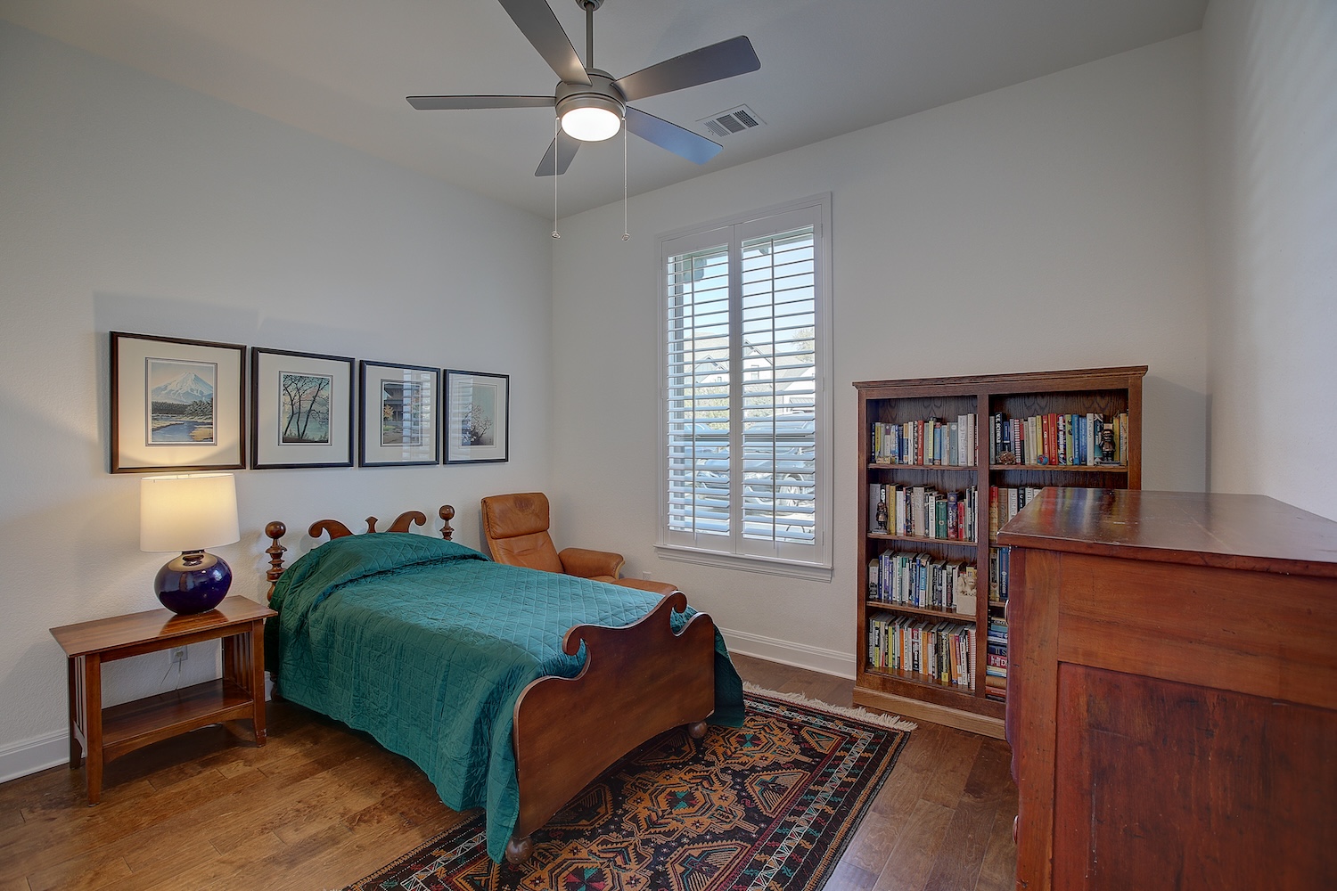 129 Hollytree Court Georgetown, TX 78628 - Photo 37 of 40 Bedroom # 1 features plantation shutters, and an en suite bath and walk in closet. Great for multi-gen, teen suite, guest room, or Nanny suite.