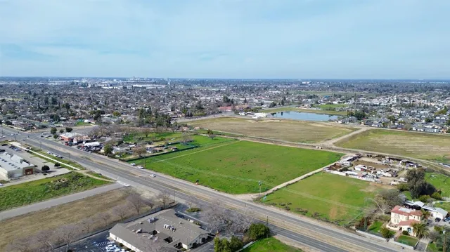 an aerial view of a residential houses with outdoor space