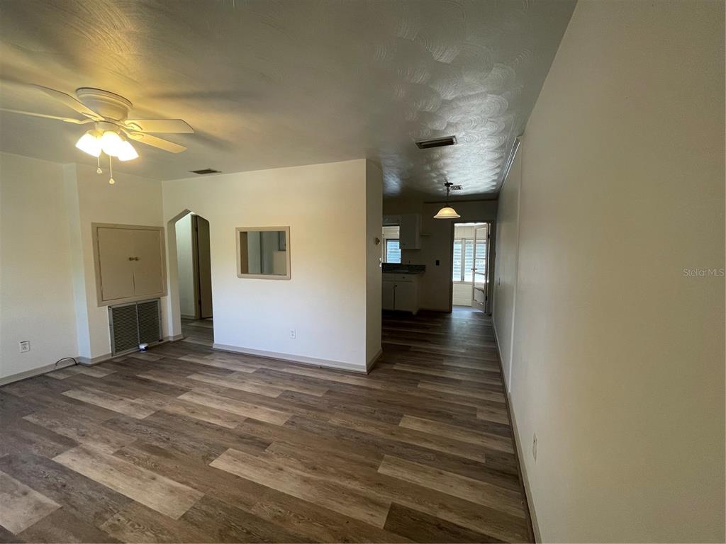 143 East South Street Deland, FL 32724 - Photo 3 of 13 a view of a hallway with wooden floor
