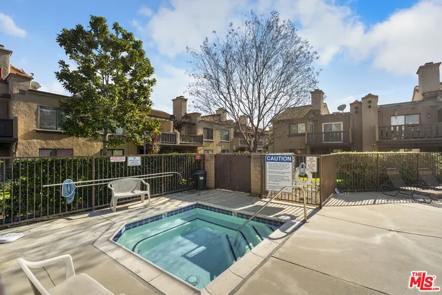 a view of a patio with a yard