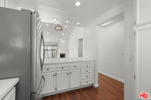 a bathroom with a double vanity sink and mirror