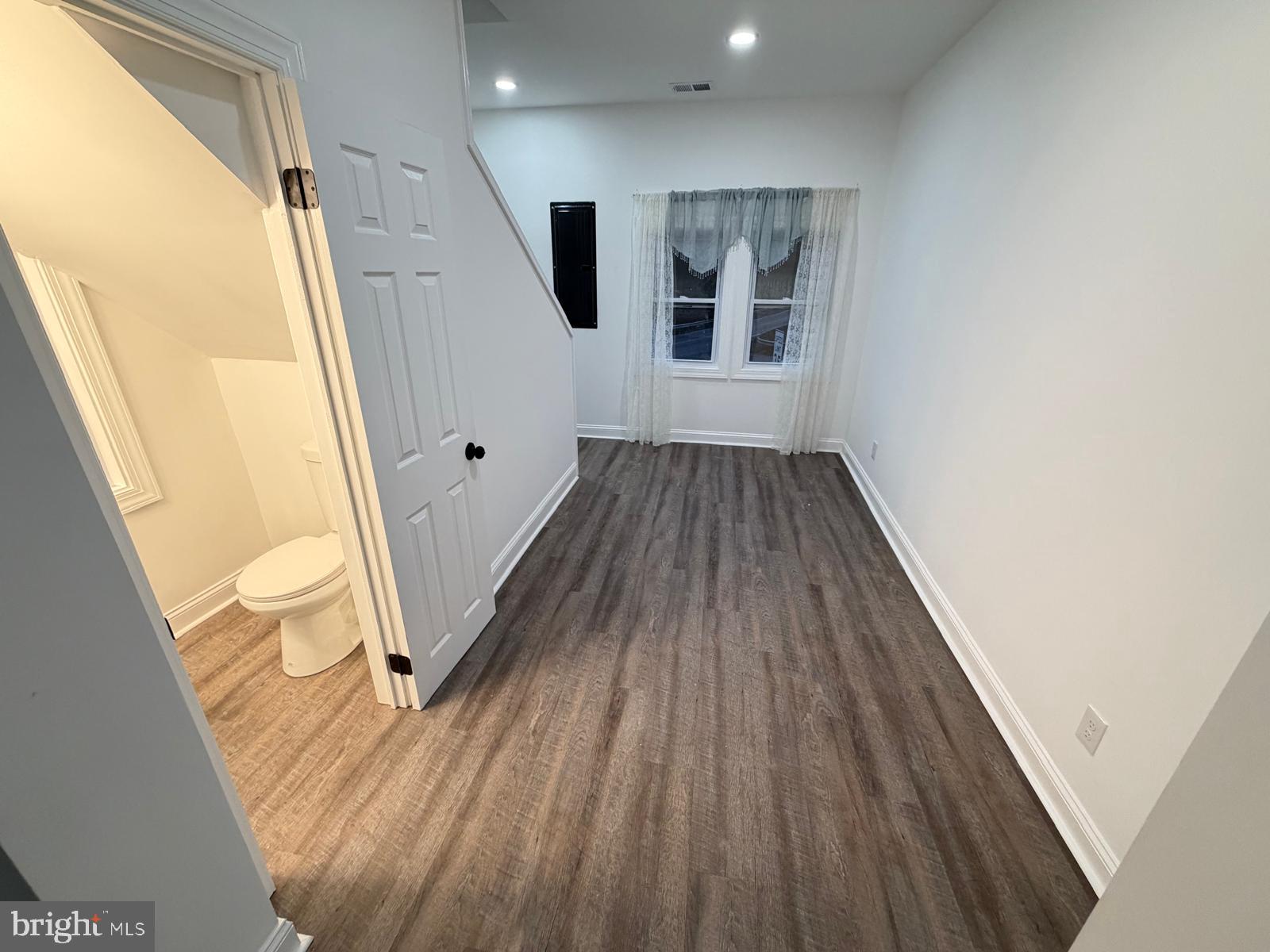 959 Golf Course Road Martinsburg, WV 25404 - Photo 11 of 35 a view of a hallway with wooden floor and stairs