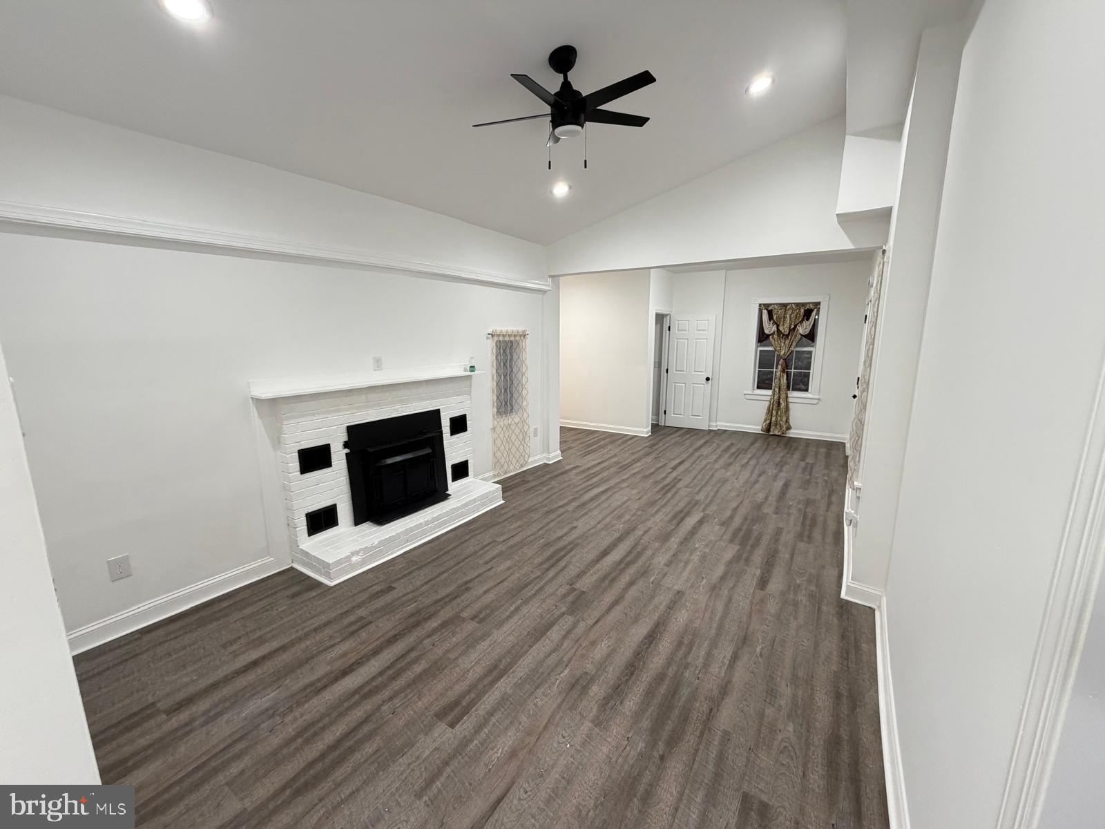 959 Golf Course Road Martinsburg, WV 25404 - Photo 14 of 35 wooden floor in an empty room with a fireplace
