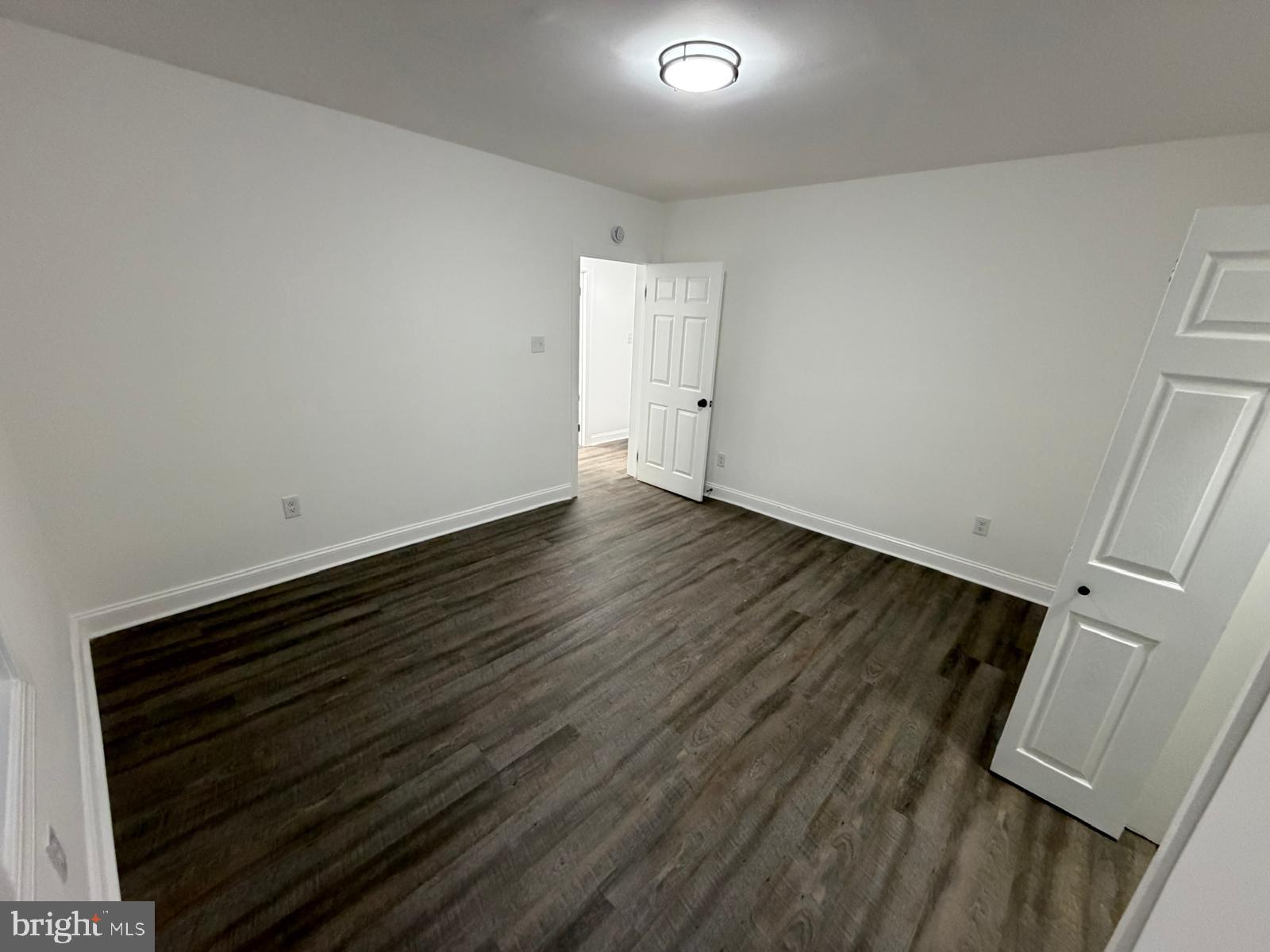 959 Golf Course Road Martinsburg, WV 25404 - Photo 18 of 35 a view of an empty room with wooden floor and a window