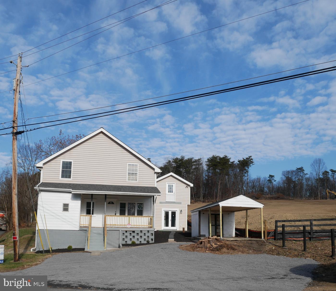 959 Golf Course Road Martinsburg, WV 25404 - Photo 2 of 35 a front view of a house with yard