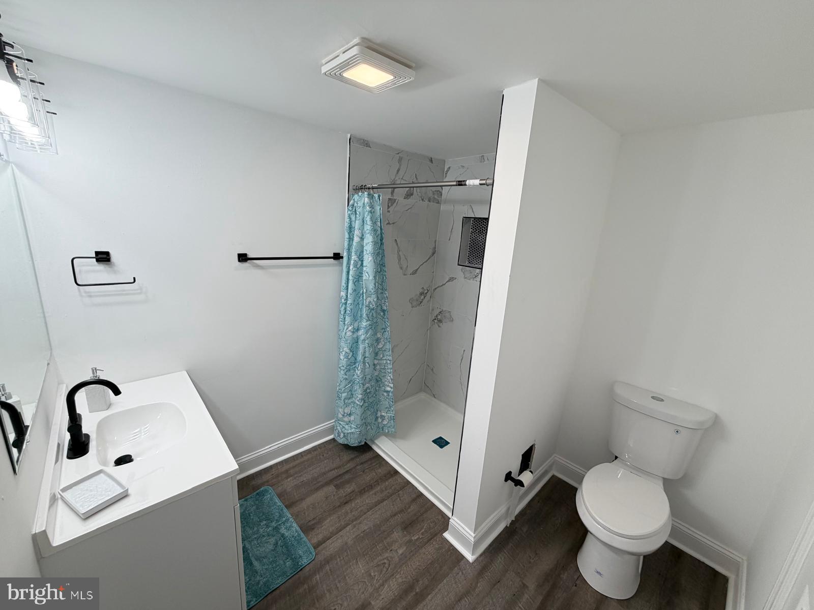 959 Golf Course Road Martinsburg, WV 25404 - Photo 21 of 35 a bathroom with a toilet sink and shower