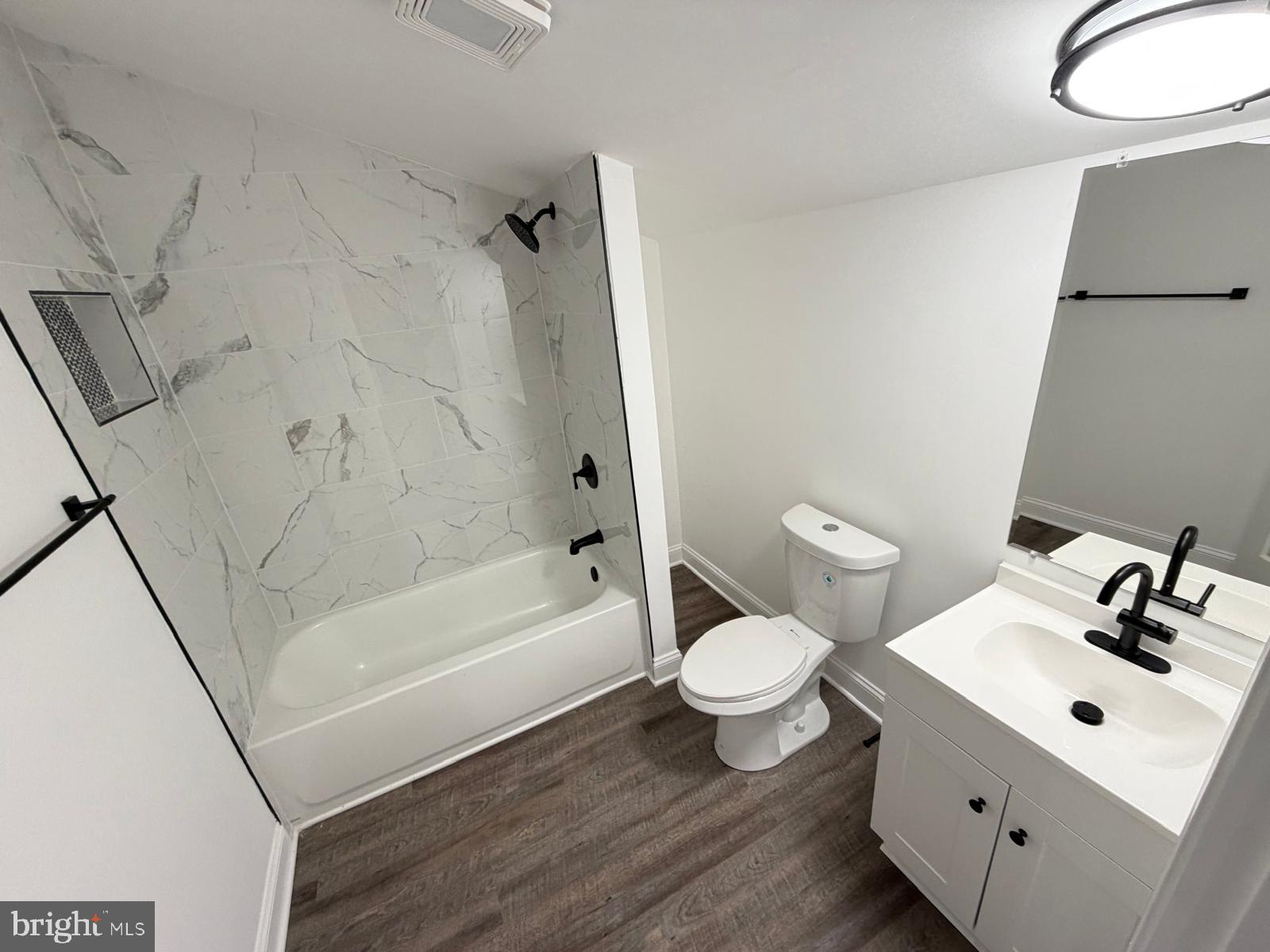 959 Golf Course Road Martinsburg, WV 25404 - Photo 27 of 35 a bathroom with a sink toilet a bathtub and vanity