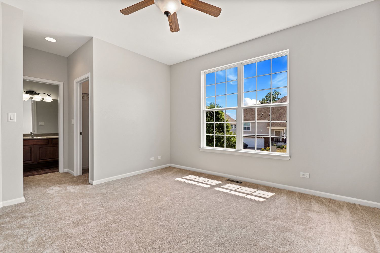 311 Timber Ridge Court Joliet, IL 60431 - Photo 12 of 24 an empty room with windows and entrance