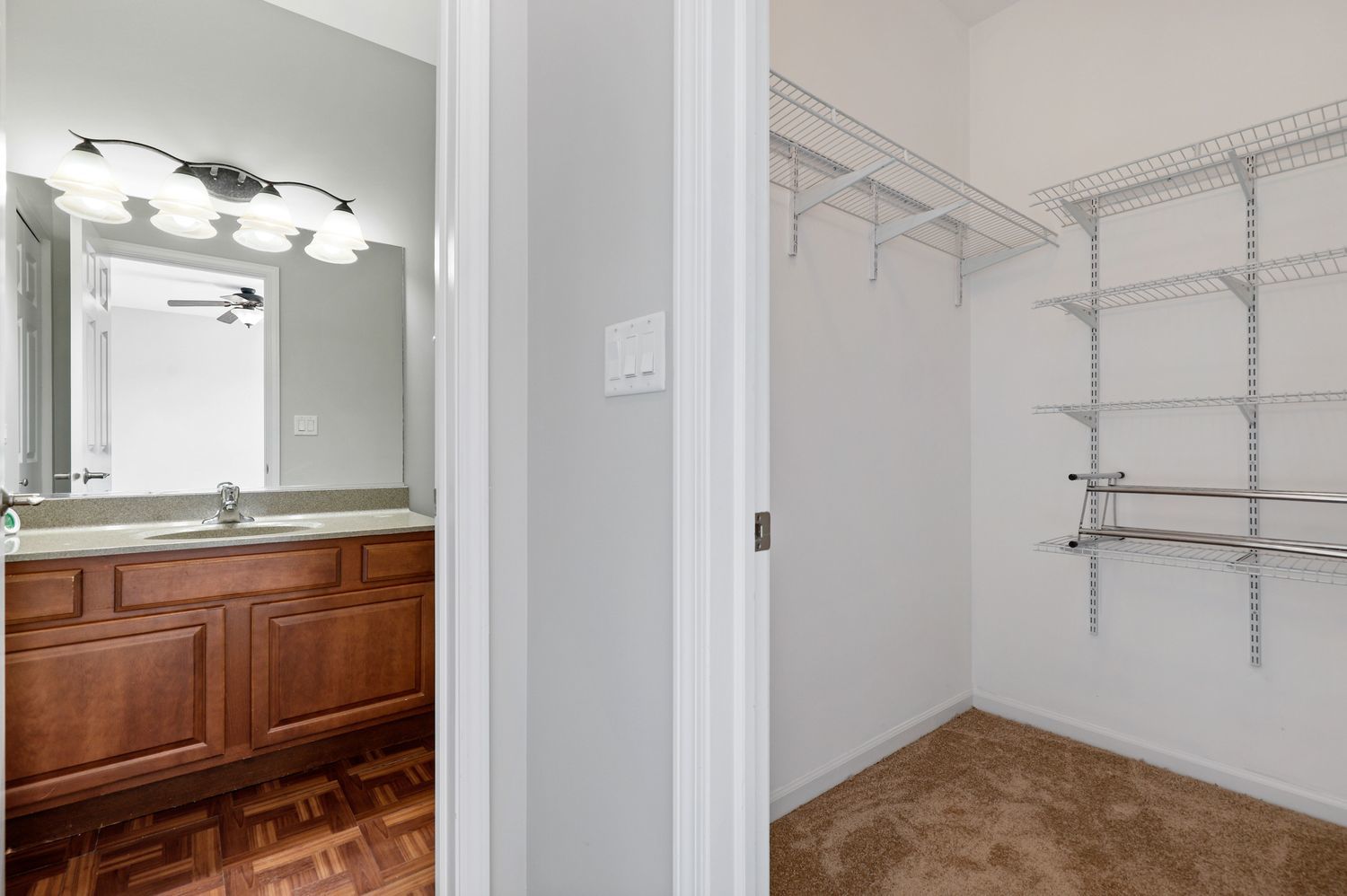 311 Timber Ridge Court Joliet, IL 60431 - Photo 13 of 24 a bathroom with a granite countertop sink a mirror and a shower