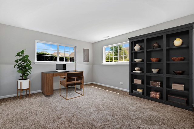 311 Timber Ridge Court Joliet, IL 60431 - Photo 17 of 24 a living room with furniture cabinets and window
