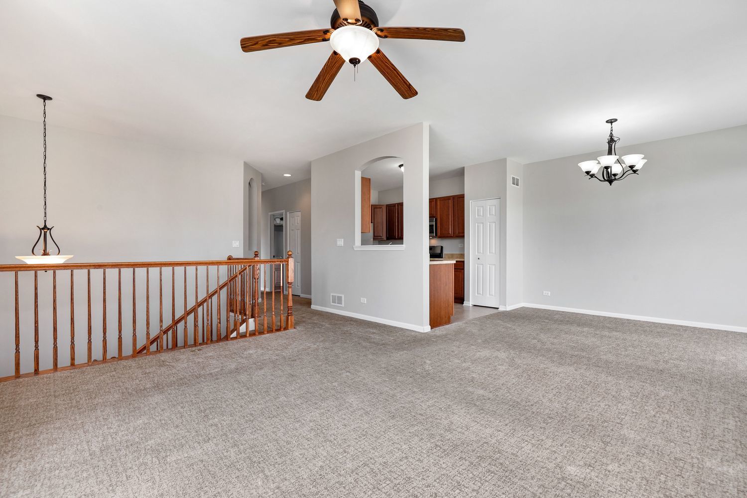 311 Timber Ridge Court Joliet, IL 60431 - Photo 6 of 24 a view of an empty room and chandelier fan