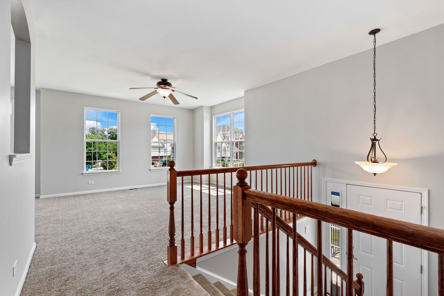 311 Timber Ridge Court Joliet, IL 60431 - Photo 7 of 24 a view of a hallway with windows