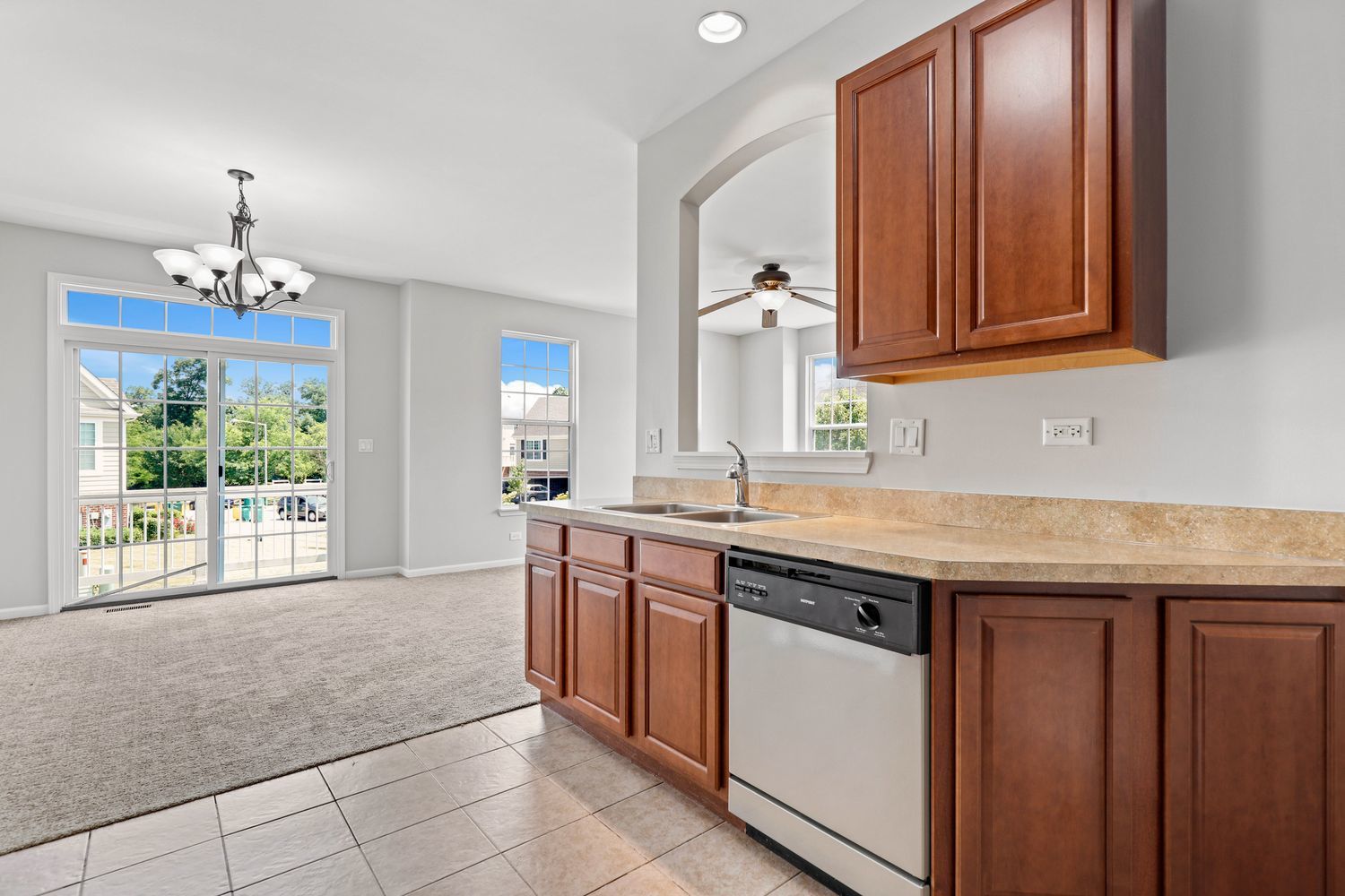 311 Timber Ridge Court Joliet, IL 60431 - Photo 8 of 24 a kitchen with a sink window and cabinets