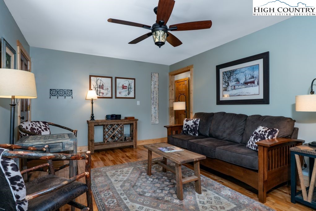 25 Red Oak Road Newland, NC 28657 - Photo 24 of 45 a living room with furniture and a wooden floor