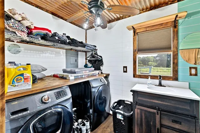 a view of a storage and utility room with washer and dryer