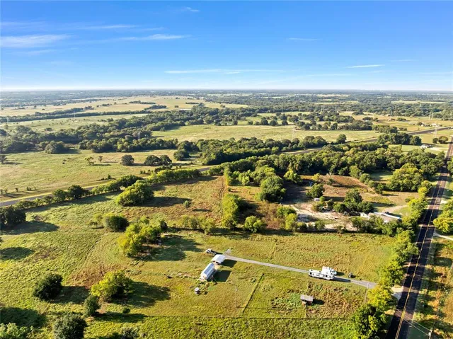 an aerial view of residential building and lake