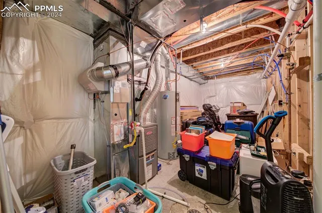 a storage room with furniture and a chandelier