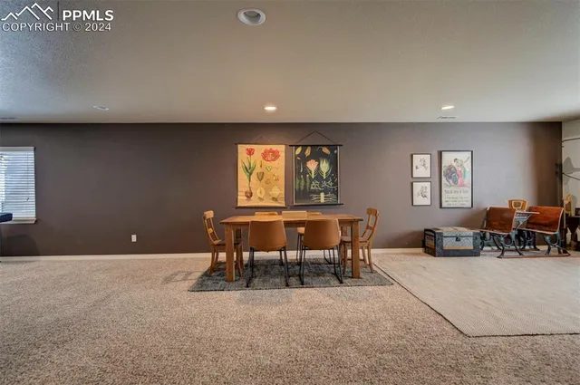 a living room with furniture a window and a table