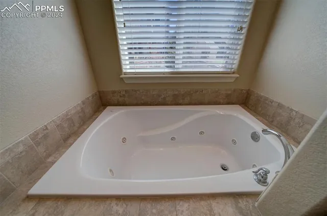 a bathroom with a bathtub