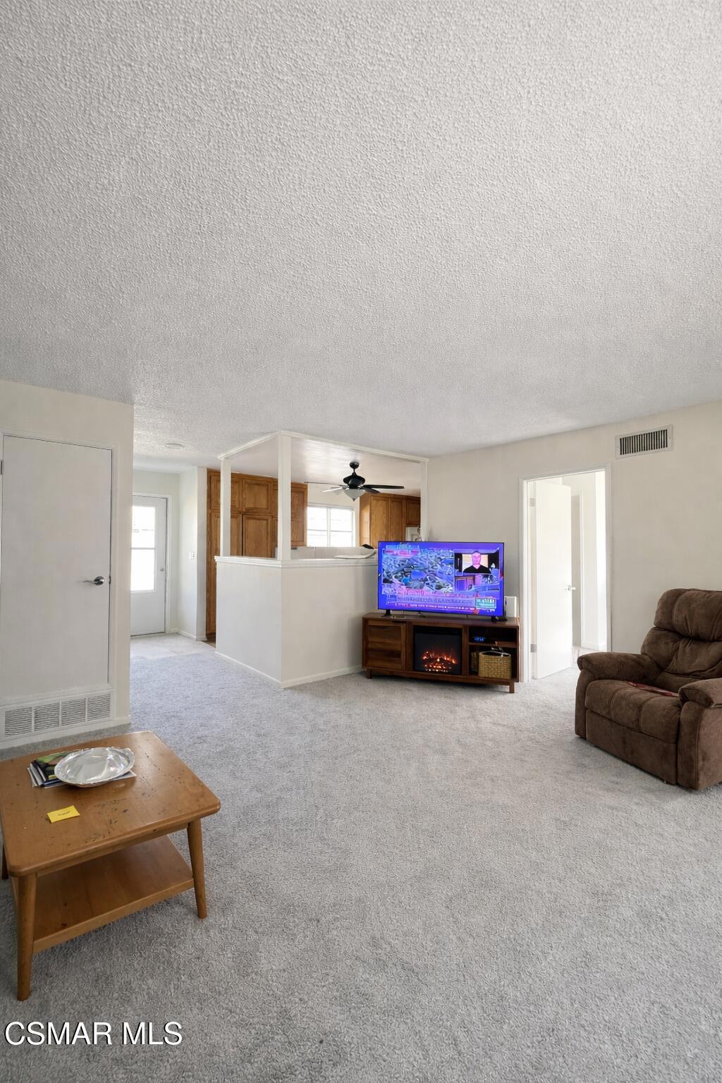 1890 Hamilton Street Simi Valley, CA 93065 - Photo 2 of 14 a living room with furniture a couch and dresser