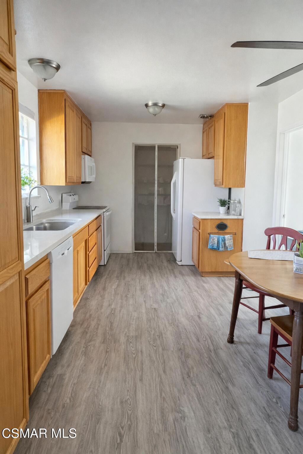 1890 Hamilton Street Simi Valley, CA 93065 - Photo 3 of 14 a view of a kitchen with cabinets and wooden floor