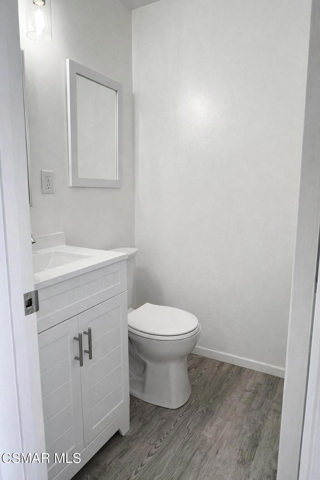 1890 Hamilton Street Simi Valley, CA 93065 - Photo 6 of 14 a bathroom with a sink toilet and vanity
