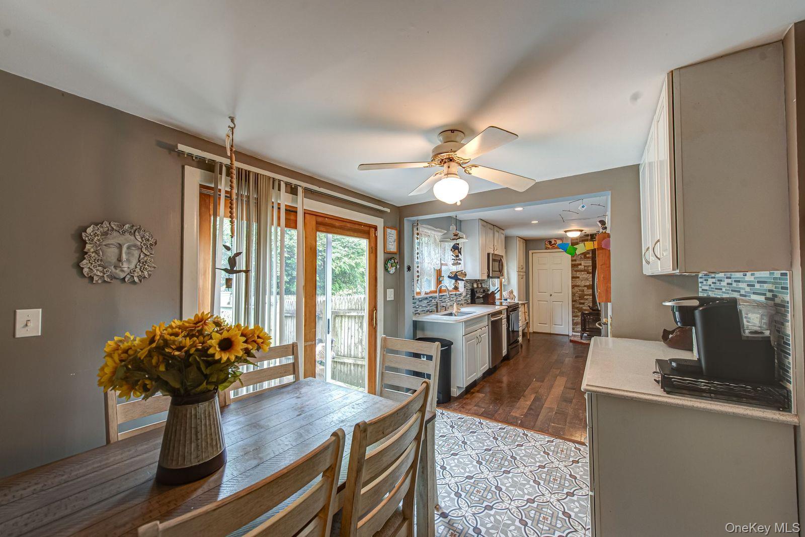 75 Upper Dock Road Kings Park, NY 11754 - Photo 11 of 30 a living room with furniture and a large window