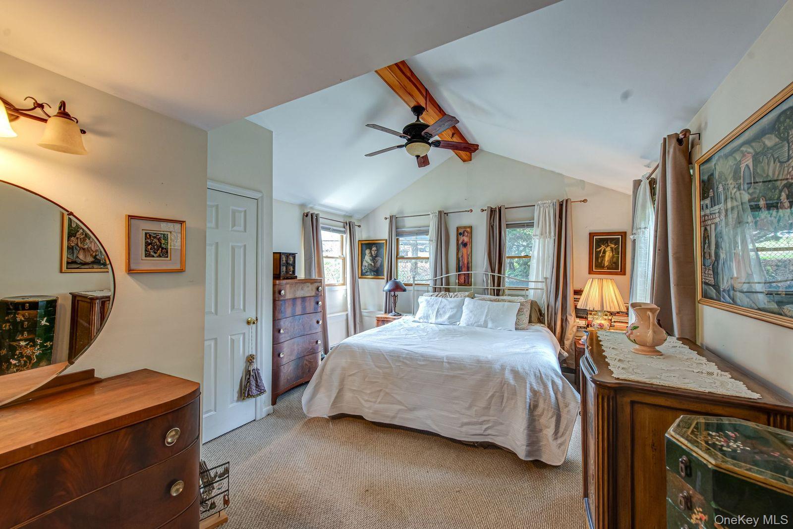 75 Upper Dock Road Kings Park, NY 11754 - Photo 13 of 30 a bedroom with a bed and a desk