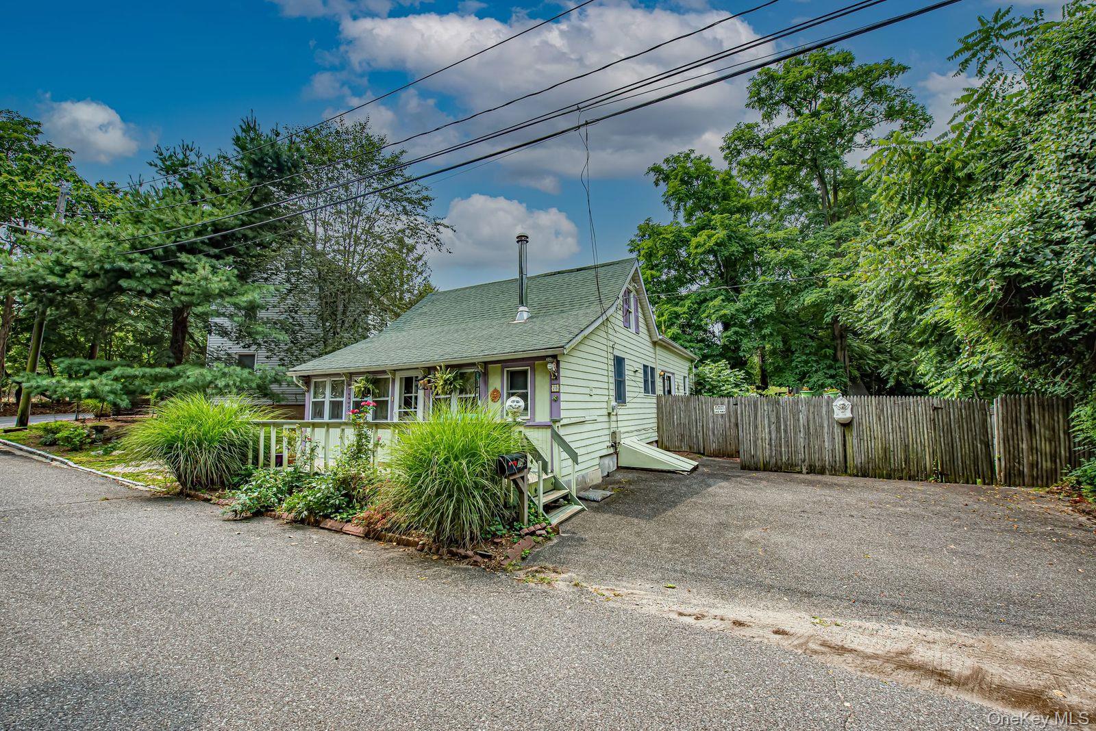 75 Upper Dock Road Kings Park, NY 11754 - Photo 20 of 30 a view of a house with a garden