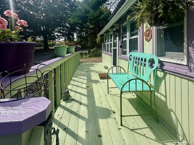 75 Upper Dock Road Kings Park, NY 11754 - Photo 2 of 30 a view of a chairs and table in patio