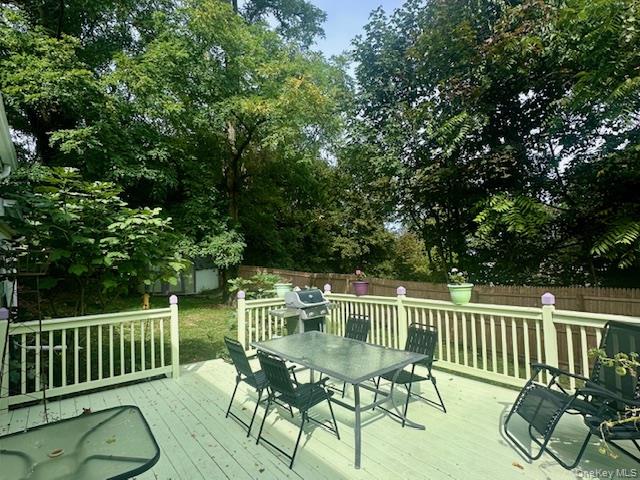 75 Upper Dock Road Kings Park, NY 11754 - Photo 21 of 30 a view of a chair and table on the deck