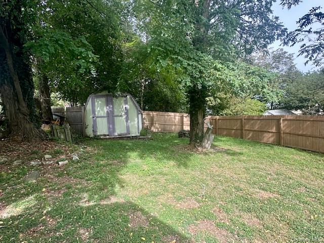 75 Upper Dock Road Kings Park, NY 11754 - Photo 25 of 30 a backyard of a house with large trees and entertaining space