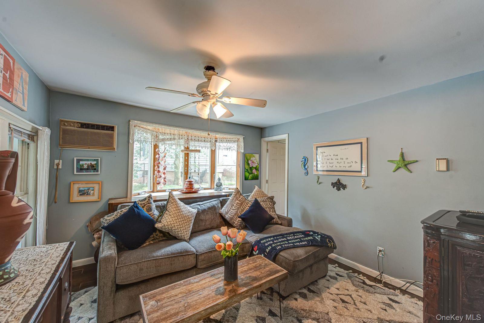 75 Upper Dock Road Kings Park, NY 11754 - Photo 6 of 30 a living room with furniture and wooden floor