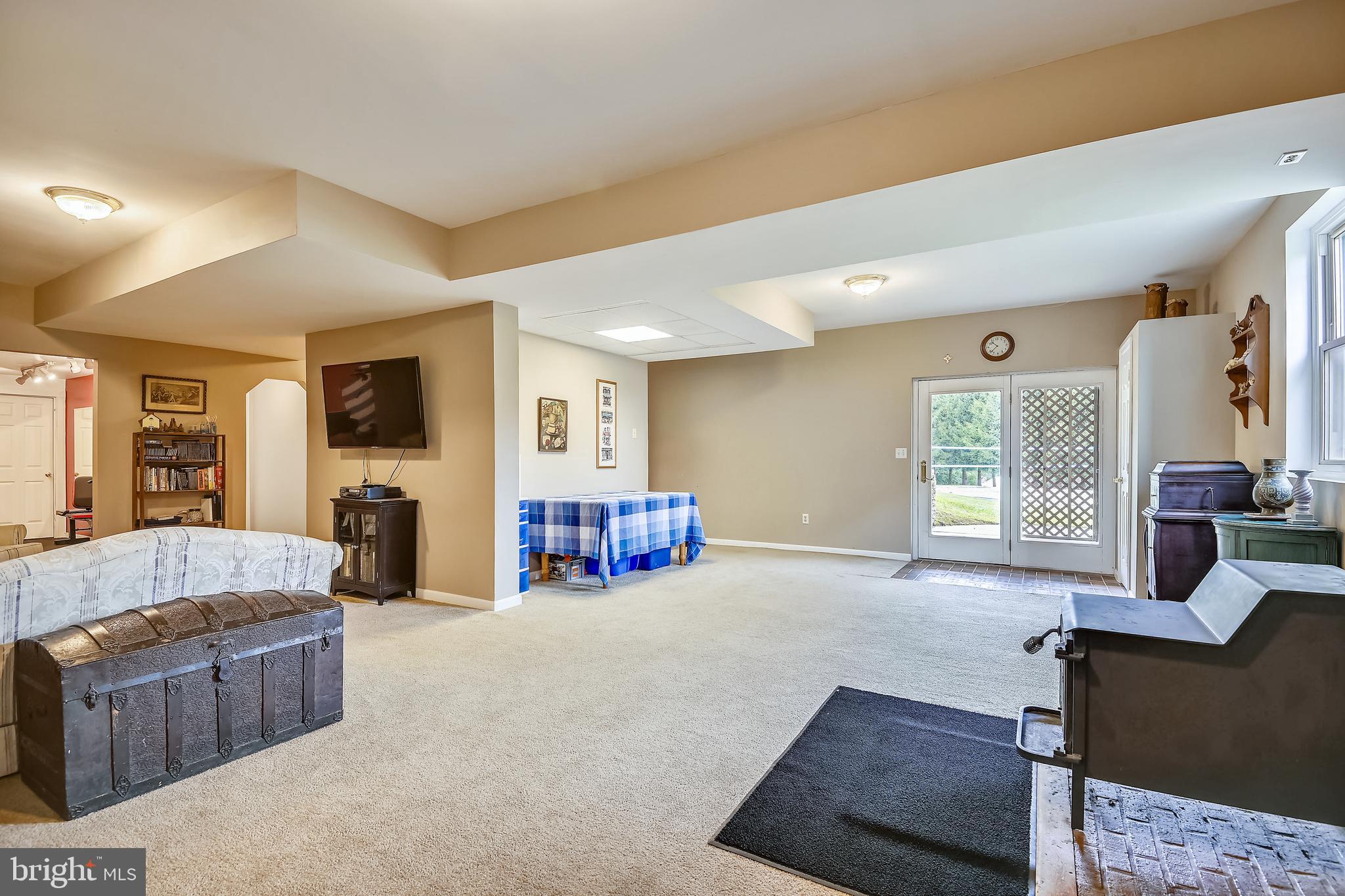 4326 Lineboro Road Manchester, PA 21102 - Photo 19 of 46 Lower Level Family Room with Wood Stove