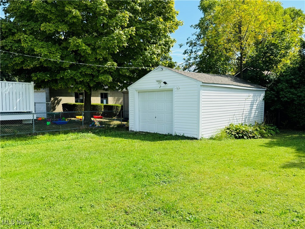 930 Reed Avenue Akron, OH 44306 - Photo 22 of 23 View of outdoor structure with a yard and a garage